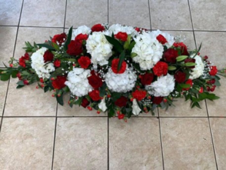 Red and white hydrangea coffin spray