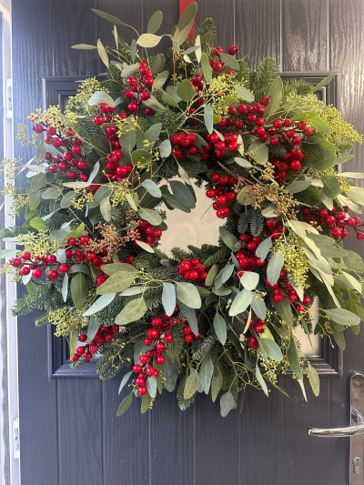 Luxe Berry - Bring understated festive elegance to your home with the Natural Eucalyptus & Berry Christmas Wreath. Handcrafted with fresh evergreen foliage, this beautifully organic design is filled with fragrant eucalyptus and abundant clusters of vibrant red berries, creating a fresh, natural look with timeless appeal. Its soft green tones and rich seasonal accents make it a perfect choice for those who love a classic, minimalist Christmas style, offering a warm and welcoming display throughout the festive season.